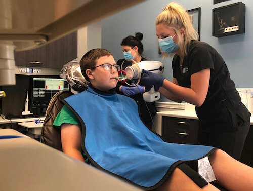 A patient is having sedation treatment at walton family dentistry