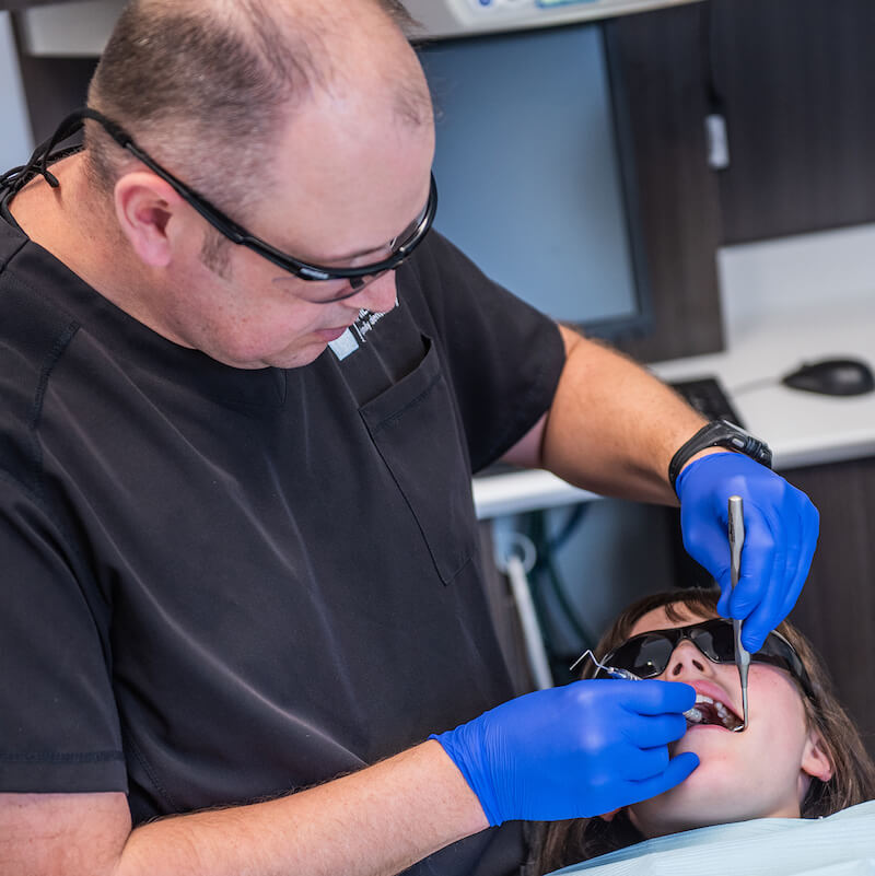 A patient having oral exam at Walton Family Dentistry