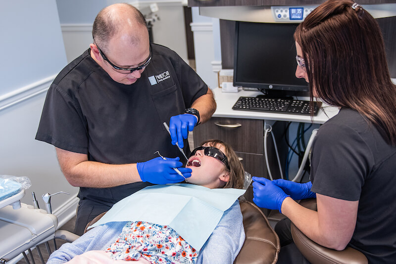 A patient having oral exam at Walton Family Dentistry